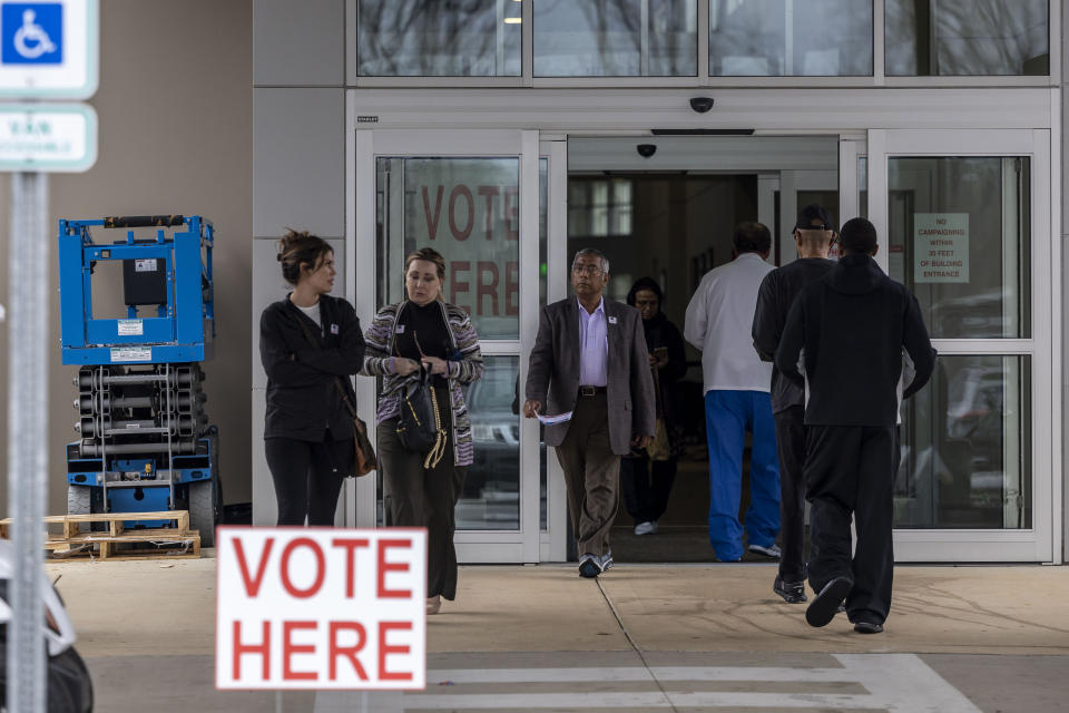 Voters arrive and depart in the lunchtime hour at Tuscaloosa county Ward 23 Church of the Highlands, during a primary election, Tuesday, March 5, 2024, in Tuscaloosa, Ala. Fifteen states and a U.S. territory hold their 2024 nominating contests on Super Tuesday this year. (AP Photo/Vasha Hunt)