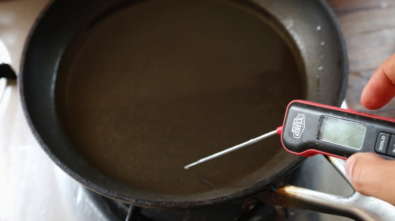 thermometer in skillet of oil