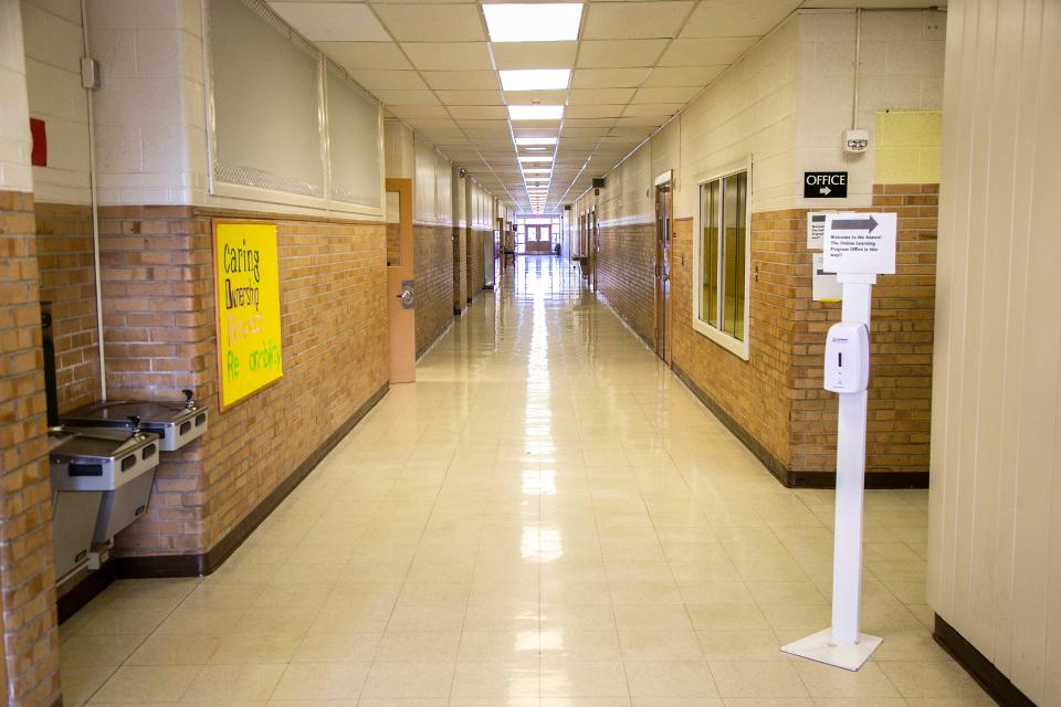 The main hallway of the former Hoover Elementary School building is seen, Friday, Feb. 11, 2022, at 2200 E. Court St. in Iowa City, Iowa. The building is used by the district for some classes with City High students and houses its ICCSD Online Program.