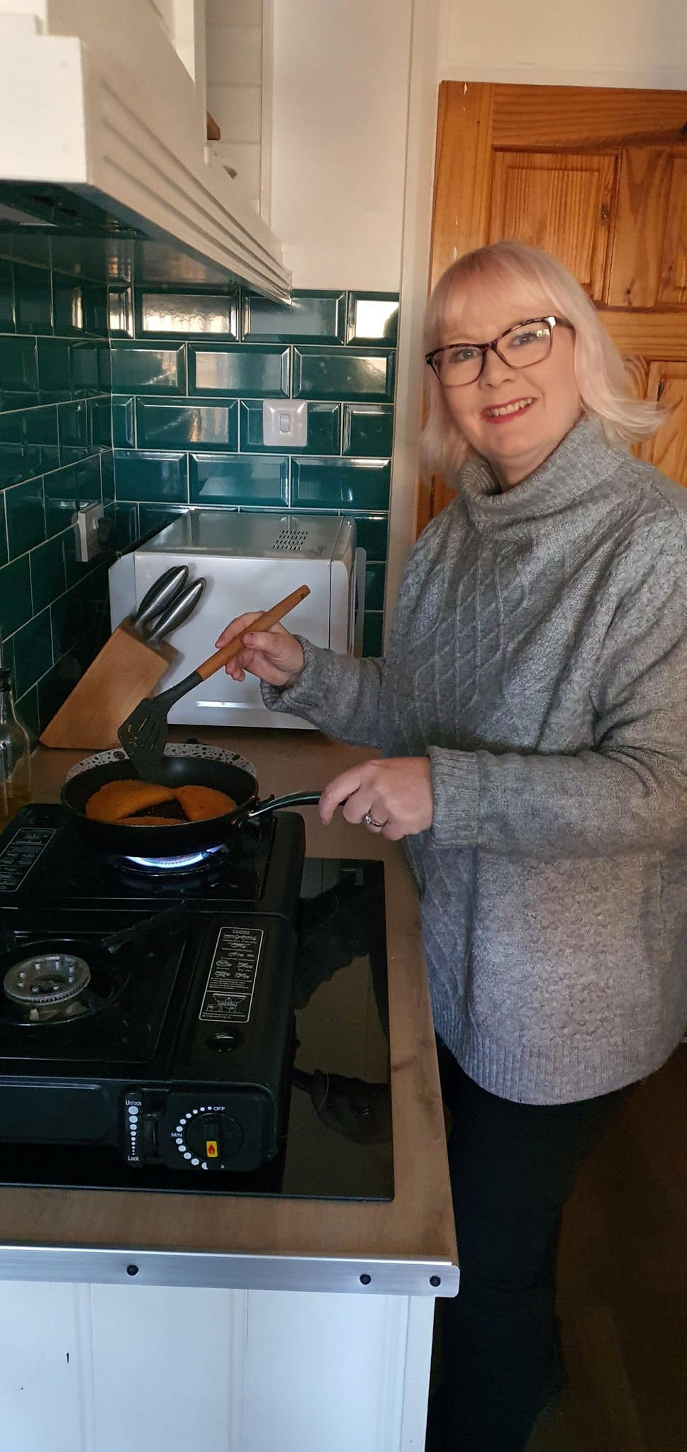 Collinson using her camping stoves. (Kerry Collinson/SWNS)