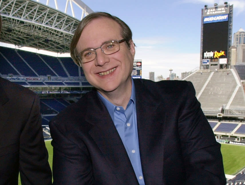 FILE - In this July 17, 2001 file photo, Seattle Seahawks owner Paul Allen appears in a suite in the team's stadium in Seattle. Allen, billionaire owner of the Trail Blazers and the Seattle Seahawks and Microsoft co-founder, died Monday, Oct. 15, 2018 at age 65. Earlier this month Allen said the cancer he was treated for in 2009, non-Hodgkin’s lymphoma, had returned. (AP Photo/Elaine Thompson, File)