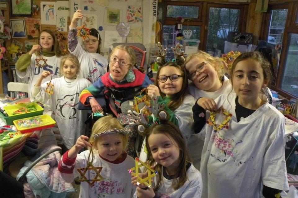 Lizzie Baily, centre, with children from the creative art workshops <i>(Image: Lizzie Bailey)</i>