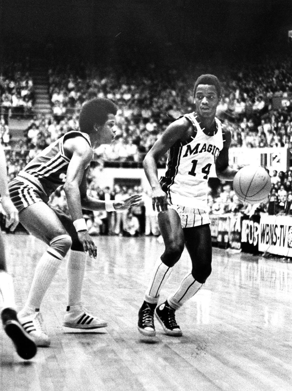 Former Barberton High School basketball player Fred Grisby dribbles in March 1977.