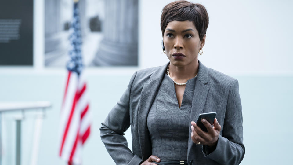 Angela Bassett taking a serious phone call in her office in Mission: Impossible - Fallout.