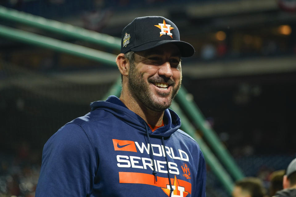 Houston Astros starting pitcher Justin Verlander smiles before Game 3 of baseball's World Series between the Houston Astros and the Philadelphia Phillies on Tuesday, Nov.  1, 2022, in Philadelphia.  (AP Photo/Chris Szagola)