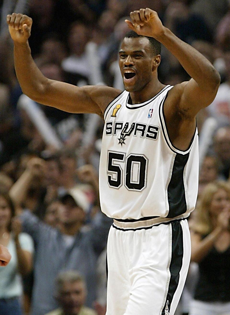 David Robinson of the San Antonio Spurs celebrates after beating the New Jersey Nets in game six of the NBA Finals at SBC Center in San Antonio, Texas. 
