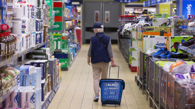 A woman peruses items at Aldi 