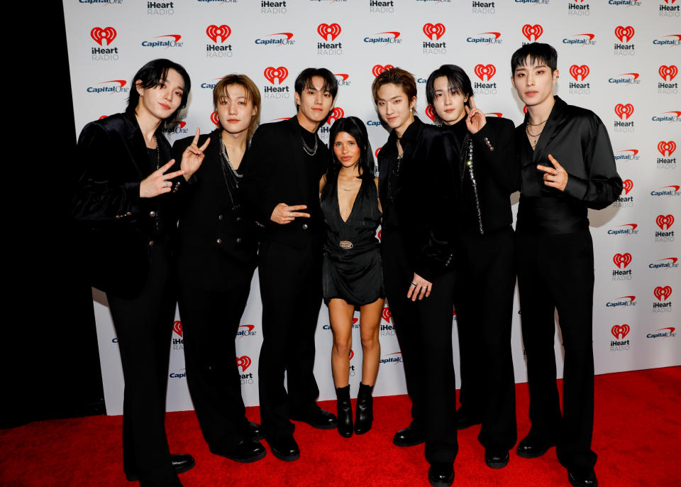 (L-R) Theo, Jongseob, Intak, Jiung, Soul, and Keeho of P1Harmony with Nessa Barrett (Center)