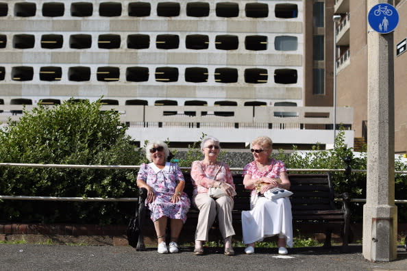 Elderly ladies share a joke as members of the public enjoy the warm weather at the seaside on August 18, 2012 in Worthing, England. Many areas of the UK are experiencing the hottest day of the year so far, with some parts seeing the temperature exceed 32 degrees Celsius. (Photo by Oli Scarff/Getty Images)