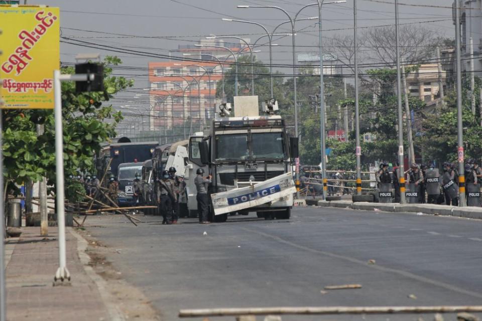 Security forces intervene in protesters as they gather to protest against the military coup in Mandalay, Myanmar on February 28, 2021.<span class="copyright">Stringer/Anadolu Agency via Getty Images</span>