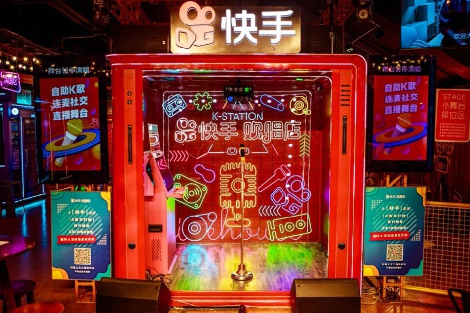 At Kuaishou’s karaoke store in Guangzhou customers can either sing on a public stage or entertain themselves in a sound-proof cubicle equipped with a screen, microphones and earphones. Photo: SCMP