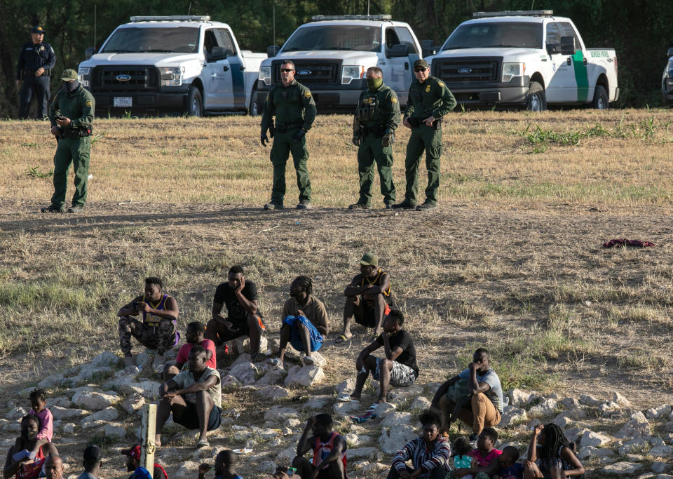  U.S. Border Patrol agents watch over immigrants 