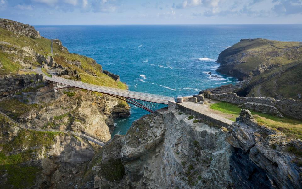 The new footbridge at Tintagel Castle soars above the sea and castle grounds - David Levene