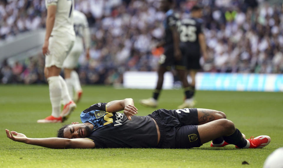 Burnley's Lorenz Assignon reacts after a challenge during the English Premier League soccer match between Tottenham Hotspur and Burnley, at the Tottenham Hotspur Stadium, London, Saturday May 11, 2024. (Adam Davy/PA via AP)