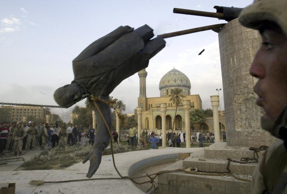 ** FILE ** The toppled statue of Saddam Hussein is seen in Firdos Square downtown Baghdad in this April 9, 2003 file photo. The statue was taken down by a US marines and Iraqis as American troops entered the capital. (AP Photo/Jerome Delay/File)