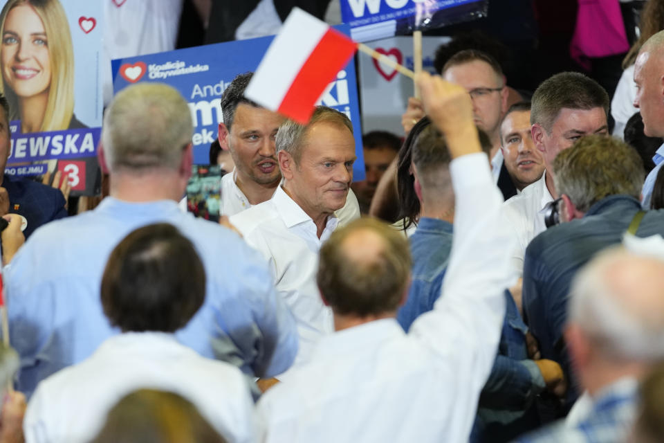 Poland's main opposition leader Donald Tusk speaks to supporters during an election rally in Pruszkow, Poland, Friday, Oct. 13, 2023. Voters in Poland are heading into a divisive election Sunday, Oct. 15, 2023, that will chart the way forward for the European Union's fifth largest country by population size and its sixth biggest economy. Centrist coalition dominated by the Civic Platform party led by Donald Tusk, 66, a former Polish prime minister and former EU president, is the main opposition party. (AP Photo/Petr David Josek)
