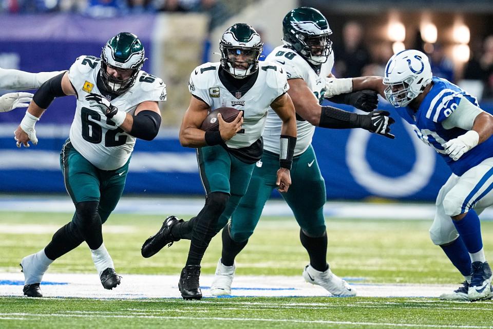 Philadelphia Eagles quarterback Jalen Hurts (1) runs against the Indianapolis Colts in the first half of an NFL football game in Indianapolis, Sunday, Nov. 20, 2022.