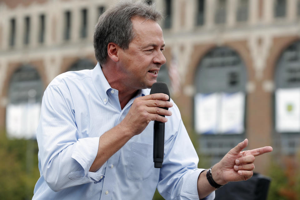 FILE - In this Aug. 16, 2018, file photo, Montana Gov. Steve Bullock speaks at the Des Moines Register Soapbox during a visit to the Iowa State Fair in Des Moines, Iowa. Motivated by an urgency to unseat President Donald Trump and the prospect of a historically large primary field, Democrats see little incentive to delay or downplay their 2020 presidential hopes. (AP Photo/Charlie Neibergall, File)