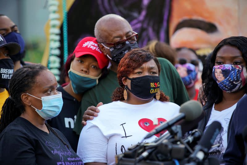 People react after a decision in the criminal case against police officers involved in the death of Breonna Taylor, in Louisville