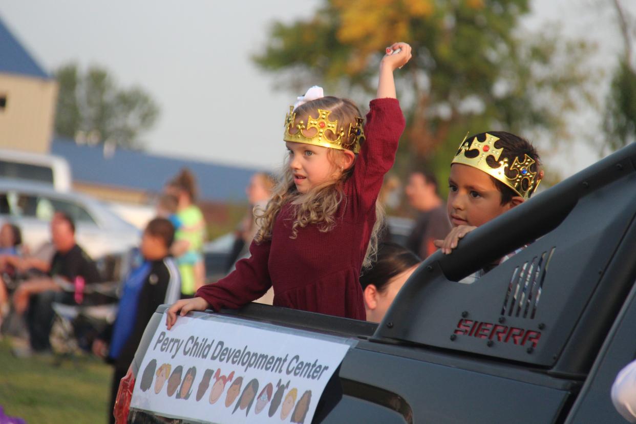 Candy is thrown from the Perry Child Development Center float during the homecoming parade on Wednesday, Sept. 14, 2022. The Perry Child Development Center will receive 100+ People for Perry funds as members selected its proposal during the Nov. 28 meeting.