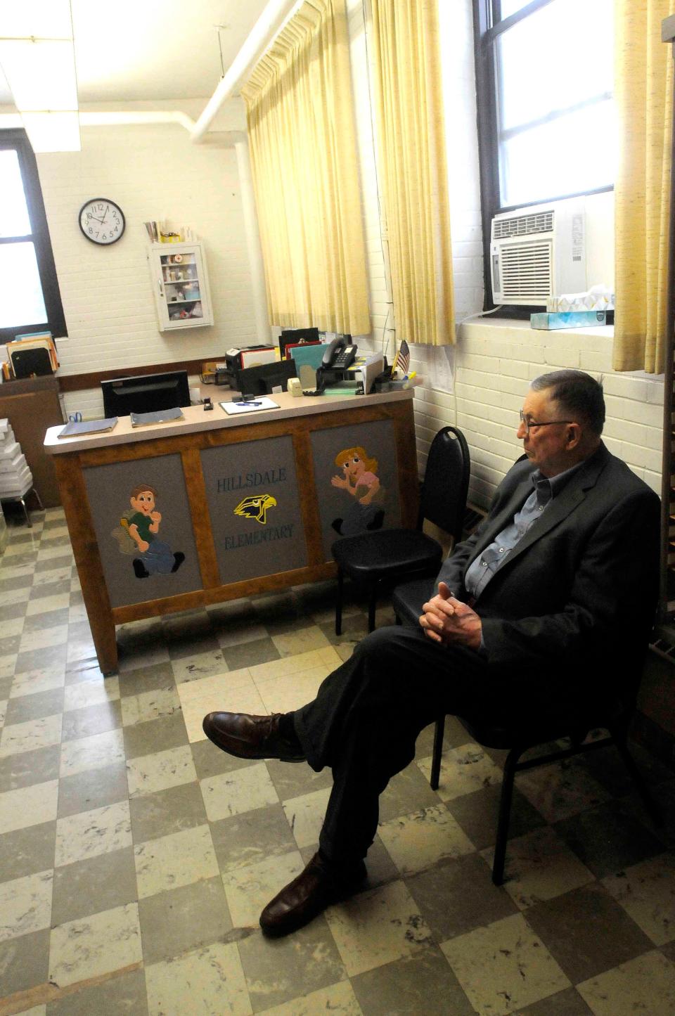 Former Principal Gene Yeater sits in the office at Hillsdale Elementary. The building was constructed in 1928.