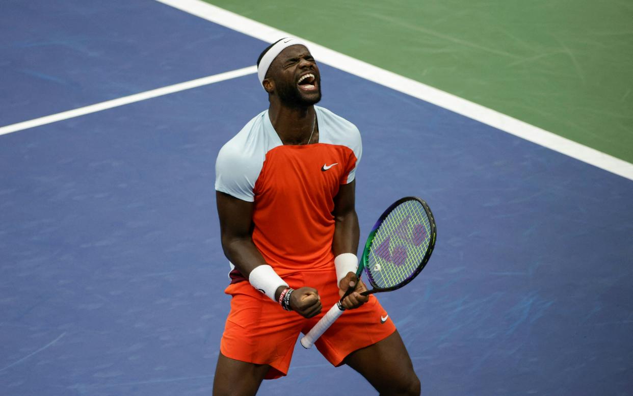 USA's Frances Tiafoe celebrates after defeating Russia's Andrey Rublev during their 2022 US Open Tennis tournament men's singles quarter-final match at the USTA Billie Jean King National Tennis Center in New York, on September 7, 2022. (Photo by KENA BETANCUR / AFP) (Photo by KENA BETANCUR/AFP via Getty Images)