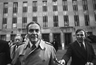 <p>President Nixon’s chief of staff, Alexander Haig, leaves U.S. District Court, Dec. 6, 1973, in Washington, after telling Judge John Sirica that Nixon was “very, very disturbed” at hearing three weeks earlier that 18 minutes of a subpoenaed Watergate tape had been erased. Behind Haig at left is Leonard Garment, a White House lawyer. (Photo: Bob Daugherty/AP) </p>