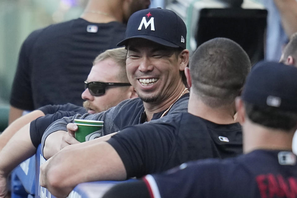 Minnesota Twins' Kenta Maeda laughs in the dugout during the first inning of a baseball game against the Cleveland Guardians, Tuesday, Sept. 5, 2023, in Cleveland. (AP Photo/Sue Ogrocki)