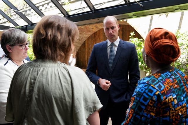 The Prince of Wales speaking to three women