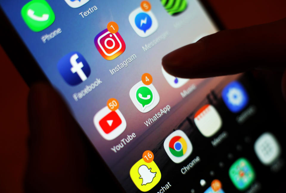 File photo dated 03/0/18 of the icons of social media apps, including Facebook, Instagram, YouTube and WhatsApp, displayed on a mobile phone screen. People who rely on social media for information about coronavirus are more likely to believe conspiracy theories and breach lockdown rules, according to a study.