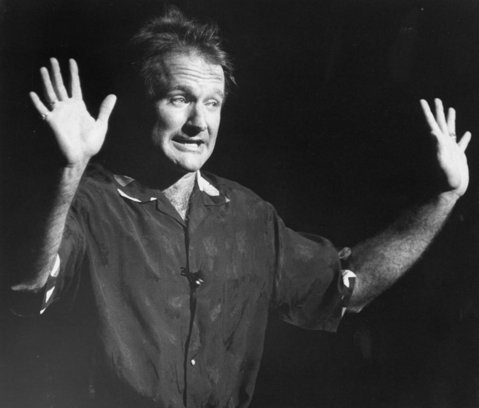 Robin Williams performs stand-up comedy during a fundraiser to benefit John Kerry's Senate campaign at the Wang Center in Boston on Oct. 23, 1990. (Photo: Boston Globe via Getty Images)