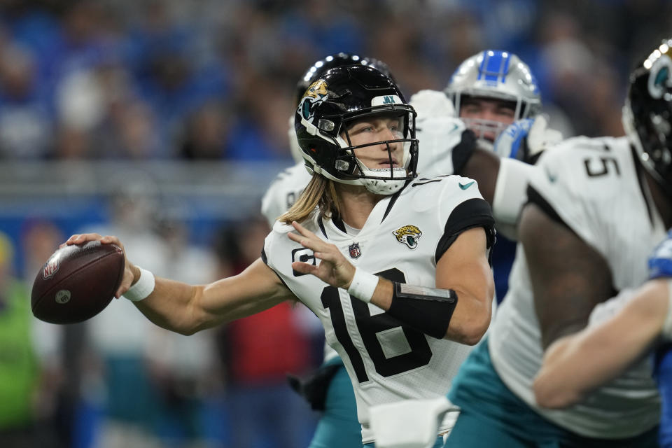 Jacksonville Jaguars quarterback Trevor Lawrence throws during the second half of an NFL football game against the Detroit Lions, Sunday, Dec. 4, 2022, in Detroit. (AP Photo/Paul Sancya)