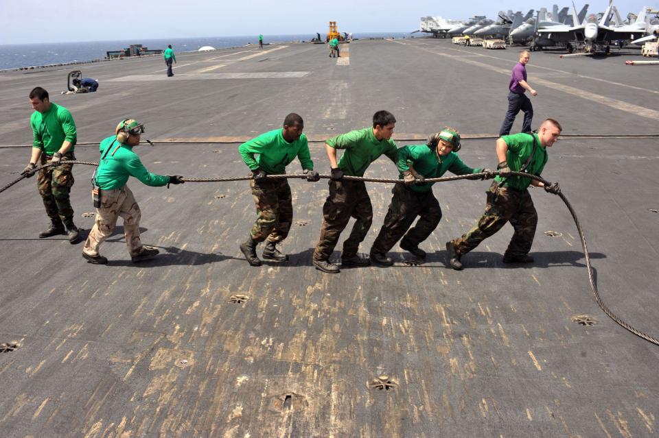 Navy sailors aboard aircraft carrier Enterprise