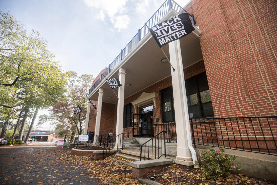 Black Lives Matter flags are displayed outside the Town Hall on Thursday, Oct. 29, 2020 in Carrboro, N.C. The North Carolina State Board of Elections ordered the town of Carrboro to remove Black Lives Matter signs from its voting site after receiving complaints, but the town says the signs will stay put. (Julia Wall/The News & Observer via AP)