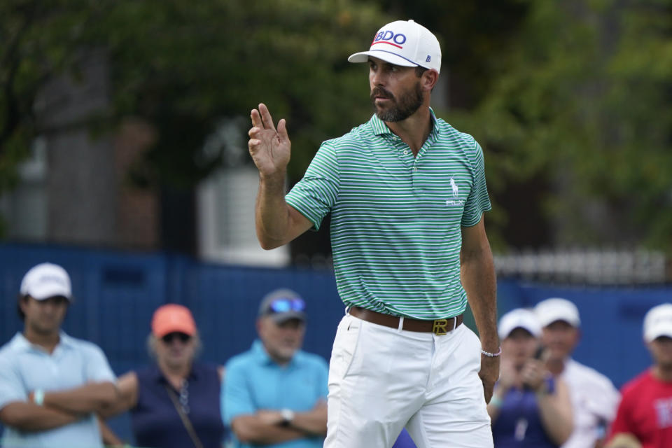 Billy Horschel reacts after making a birdie putt on the 17th hole during the second round of the Wyndham Championship golf tournament in Greensboro, N.C., Friday, Aug. 4, 2023. (AP Photo/Chuck Burton)