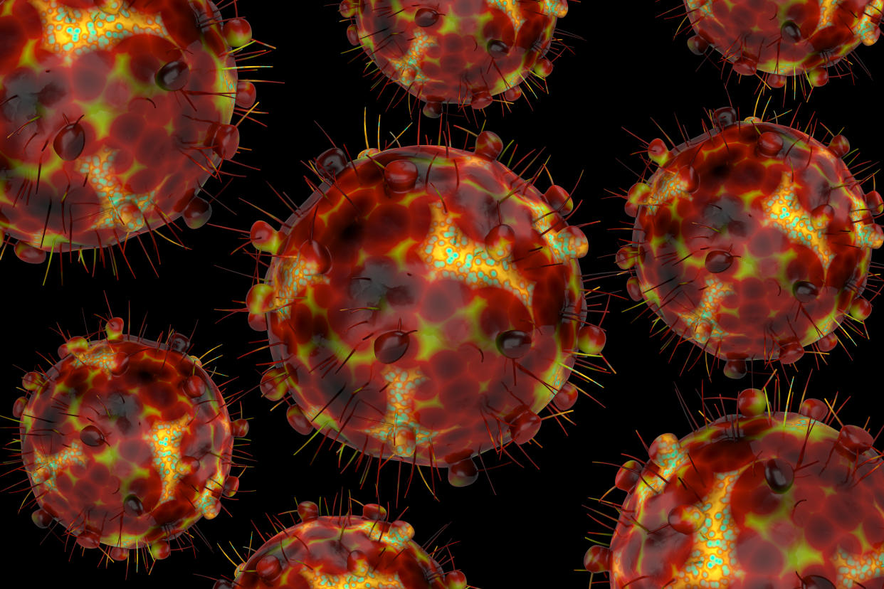 A computer-generated image of multiple copies of the Omicron variant of the coronavirus.