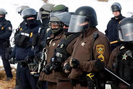 Police advance into the main opposition camp against the Dakota Access oil pipeline near Cannon Ball, North Dakota, U.S., February 23, 2017. REUTERS/Terray Sylvester