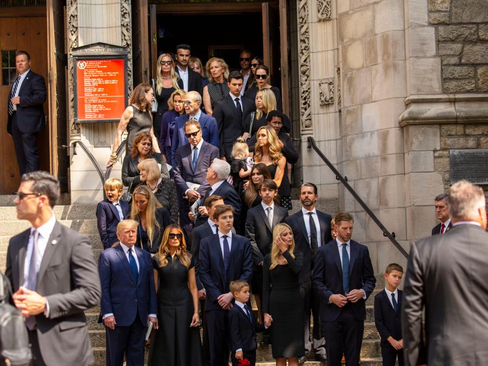 Donald Trump and family members gathered outside in front of a church.