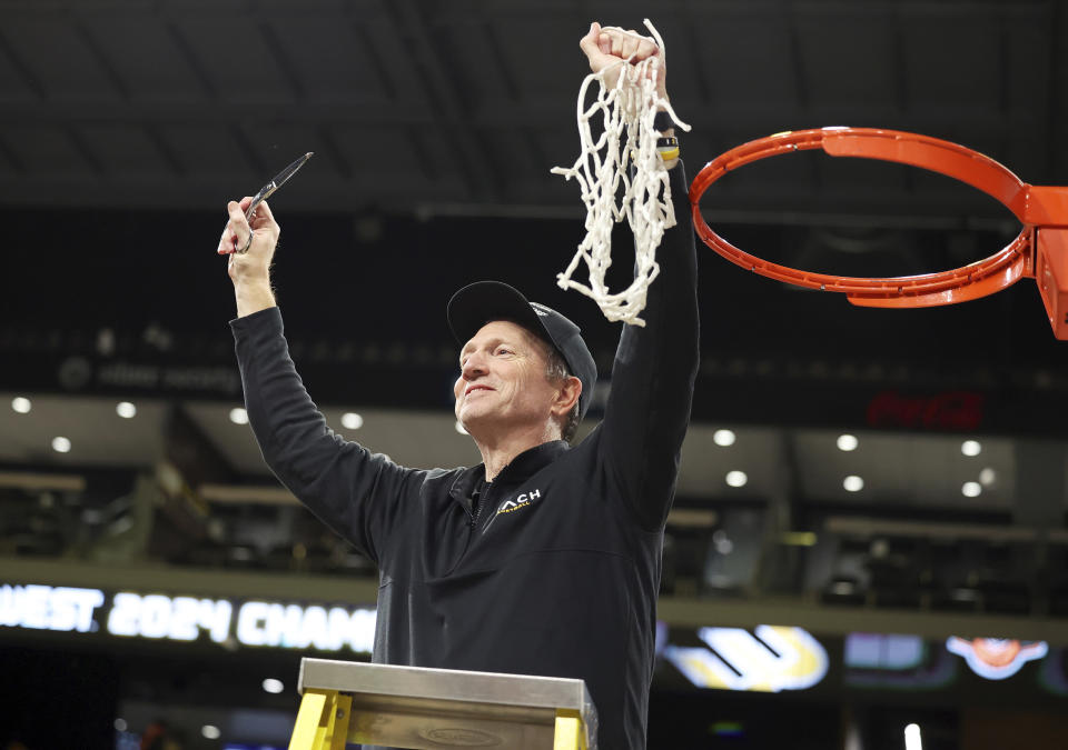 Long Beach State head coach Dan Monson participates in a net cutting ceremony after his team played an NCAA college basketball game against UC Davis in the championship of the Big West Conference men's tournament Saturday, March 16, 2024, in Henderson, Nev. Long Beach State won 74-70. (AP Photo/Ronda Churchill)