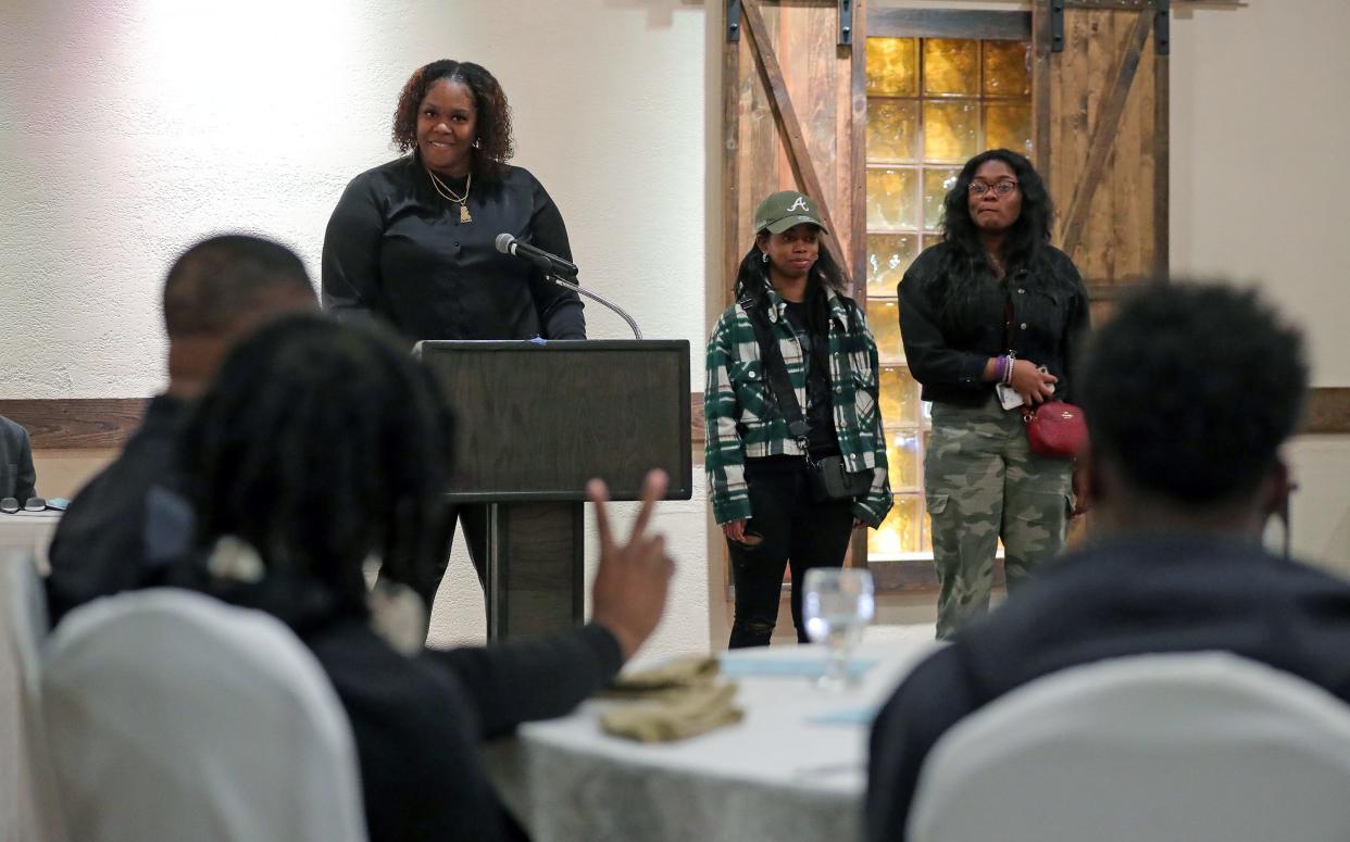 Buchtel girls basketball coach Cari Guyton speaks about her players Ameena Vincent and Aaliyah Golden during the Akron City Series high school basketball media day at Guy's Party Center on Tuesday in Akron.