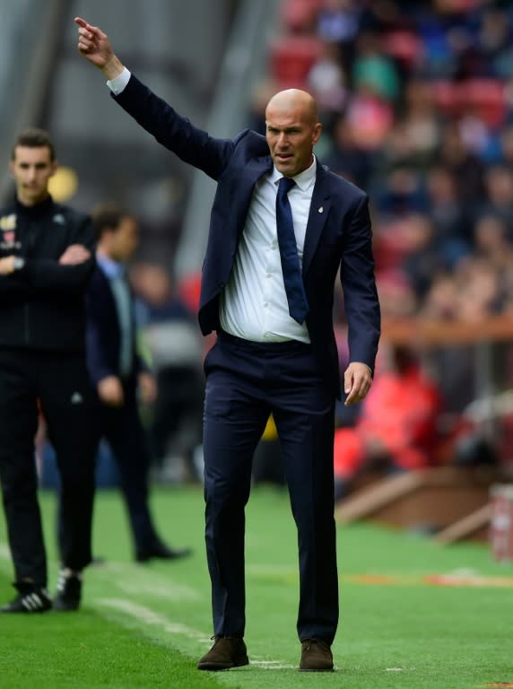 Real Madrid's Zinedine Zidane gestures during their match against Real Sporting de Gijon at El Molinon stadium in Gijon on April 15, 2017