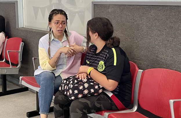 Luz Valenzuela-Trout, director of operations at the Boys and Girls Club of Buena Park, talks with a student. (Linda Jacobson)