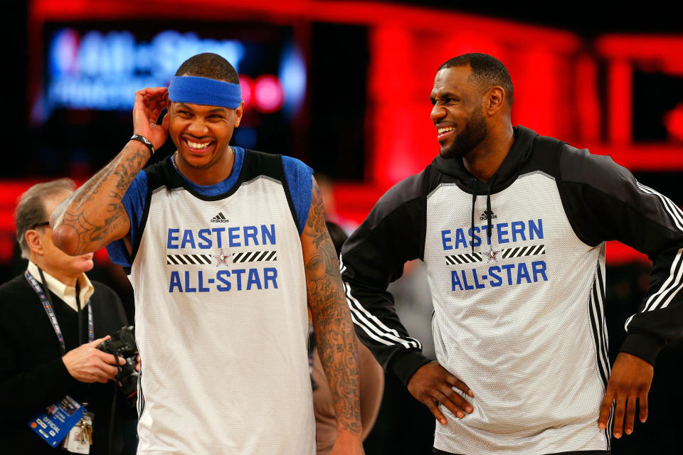 Carmelo Anthony and LeBron James laugh together in Eastern All-Star shirts. 