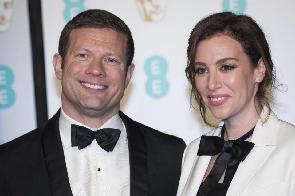 Dermot O'Leary and Dee Koppang pose for photographers upon arrival at the BAFTA Film Awards in London, Sunday, Feb. 10, 2019. (Photo by Vianney Le Caer/Invision/AP)