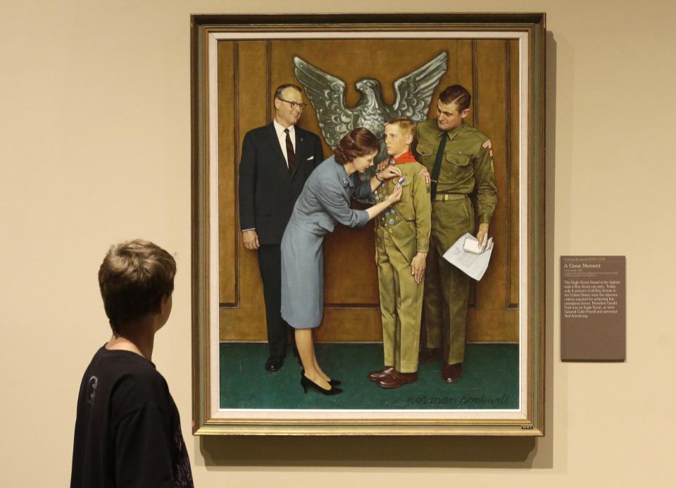 FILE - This July 22, 2013, file photo shows one of the twenty-three original, Boy Scout-themed Norman Rockwell paintings during an exhibition at the Church History Museum in Salt Lake City, Utah. The Boy Scouts of America has filed for bankruptcy protection as it faces a barrage of new sex-abuse lawsuits. The filing Tuesday, Feb. 18, 2020, in Wilmington, Del., is an attempt to work out a potentially mammoth compensation plan for abuse victims that will allow the 110-year-old organization to carry on. (AP Photo/Rick Bowmer, File)