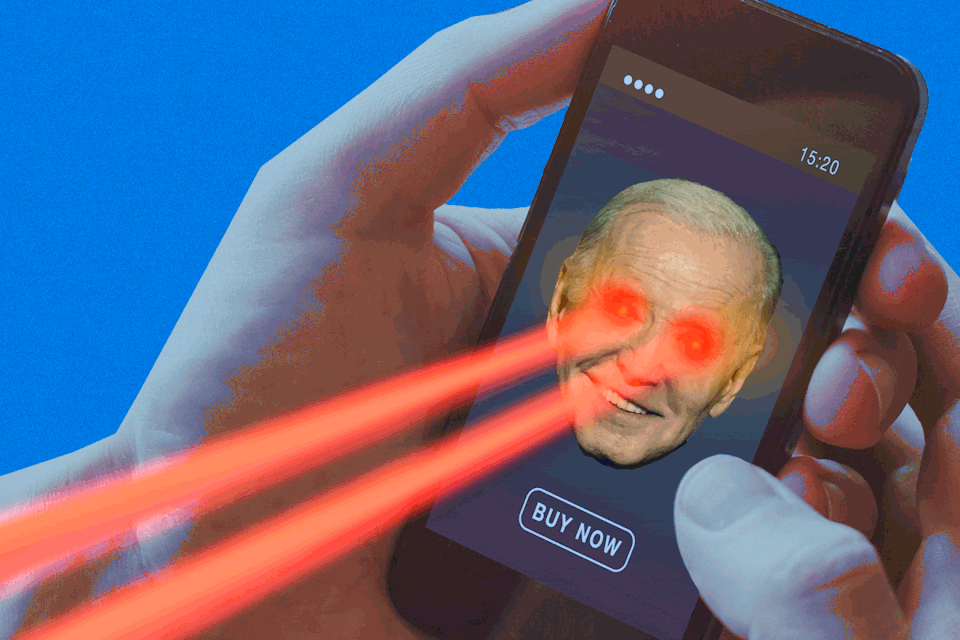 A gif of a hand holding a smartphone; Joe Biden's face is moving on the phone and laser beams are shooting out of his eyes.