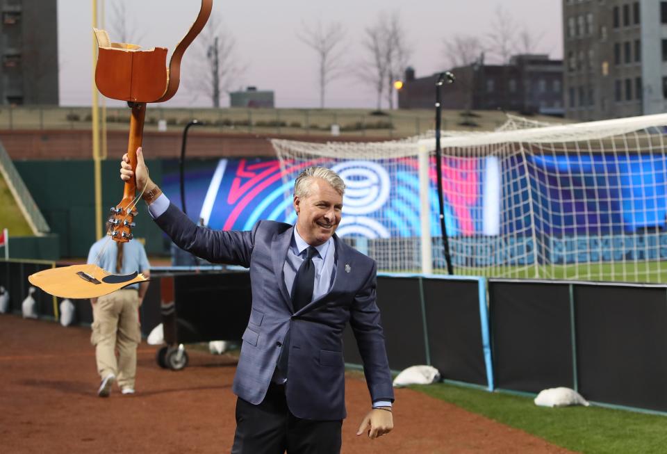 Memphis 901 FC Principal Owner Peter Freund smashes a guitar before they take on the Tampa Bay Rowdies at AutoZone Park on March 9, 2019.