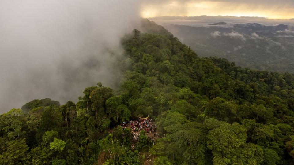 Migrants prepare to cross the Panama border in the Darién Gap in Colombia, on Aug. 3.<span class="copyright">Federico Rios—The New York Times/Redux</span>