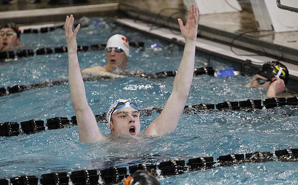 Olentangy Liberty's Hudson Williams celebrates after winning  the division I state title in the 50 yard freestyle  at C.T. Branin Natatorium on Feb. 26.  