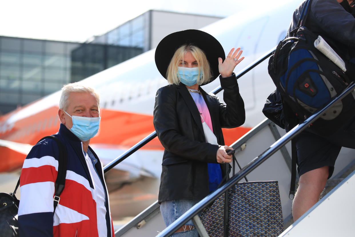 Passengers prepare to board an easyJet flight to Faro, Portugal, at Gatwick Airport in West Sussex after the ban on international leisure travel for people in England was lifted following the further easing of lockdown restrictions. Picture date: Monday May 17, 2021. (Photo by Gareth Fuller/PA Images via Getty Images)